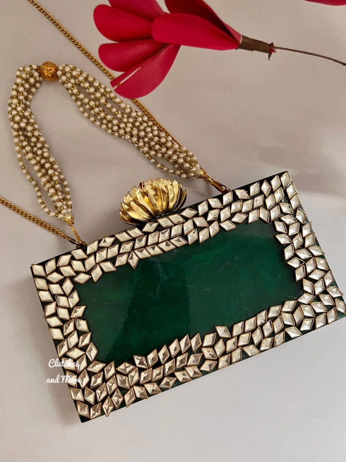 Zara Kundan Green Resin clutch with Pearl Handle